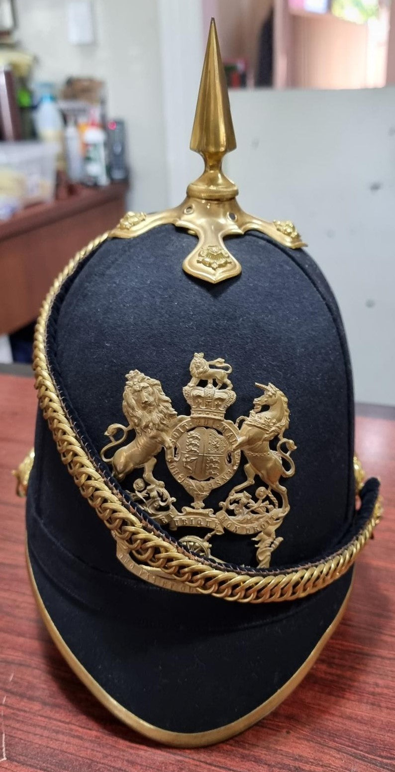 SB28 A good Victorian Artillery Blue Cloth Helmet with spike top 1878 – 81. Helmet plate original to the helmet. Silk lining still attached to the leather sweat band. Complete with velvet lined chin chain and storage tin.