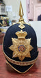 SB22 A good example of the Royal Military College Victorian Blue cloth helmet. Very good gilt fittings and perfect enamel helmet plate original to the helmet. Silk liner attached to the leather sweat band. Complete with velvet lined chin chain.