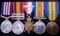 Group of 5: Military Medal G.V.R (7/8 KOSB), Queens South Africa two clasps “T, SA02” (7498 KOSB), 1914 Star with slide on clasp, British War and Victory Medals. 7498 Sgt. G. Reilly KOSB.