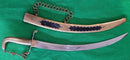 An early Georgian Naval Dirk by Collins 52 Strand. Solid brass hilt and decorative brass scabbard etched with trophy of arms.