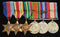 Six: 1939/45 Star, Africa Star, Pacific Star, Defence Medal, War Medal with Mentioned in despatches oak leaf and Australian Service Medal. Stars un-named as often issued, with remaining three correctly impressed to NX3735 W. H. SCHOFIELD - VF SOLD